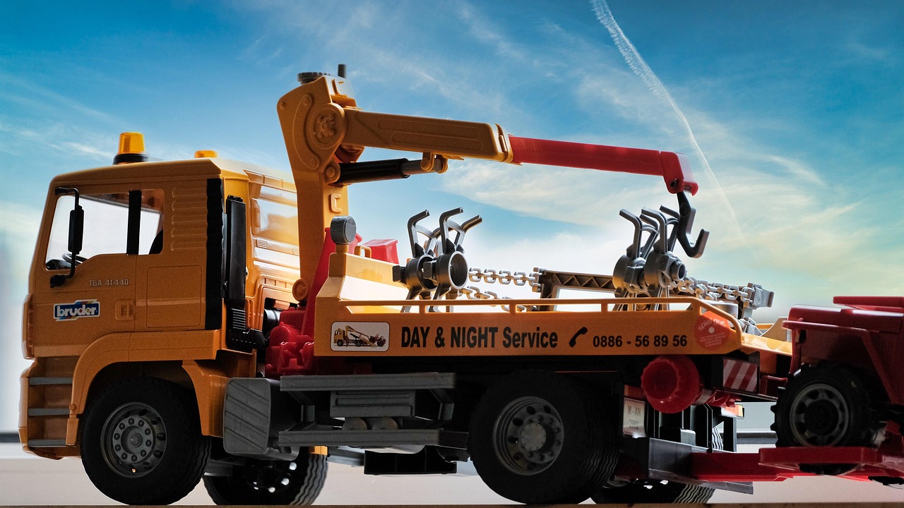 A truck towing a car after a parking violation