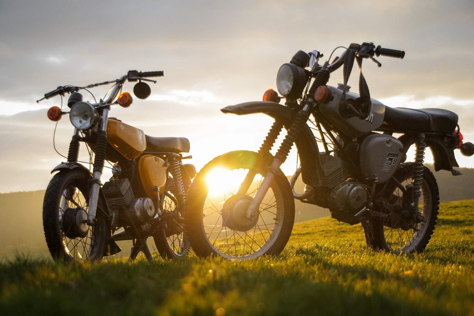 Two motorcycles with a scenic background, illustrating the benefits of getting a motorcycle license in Japan