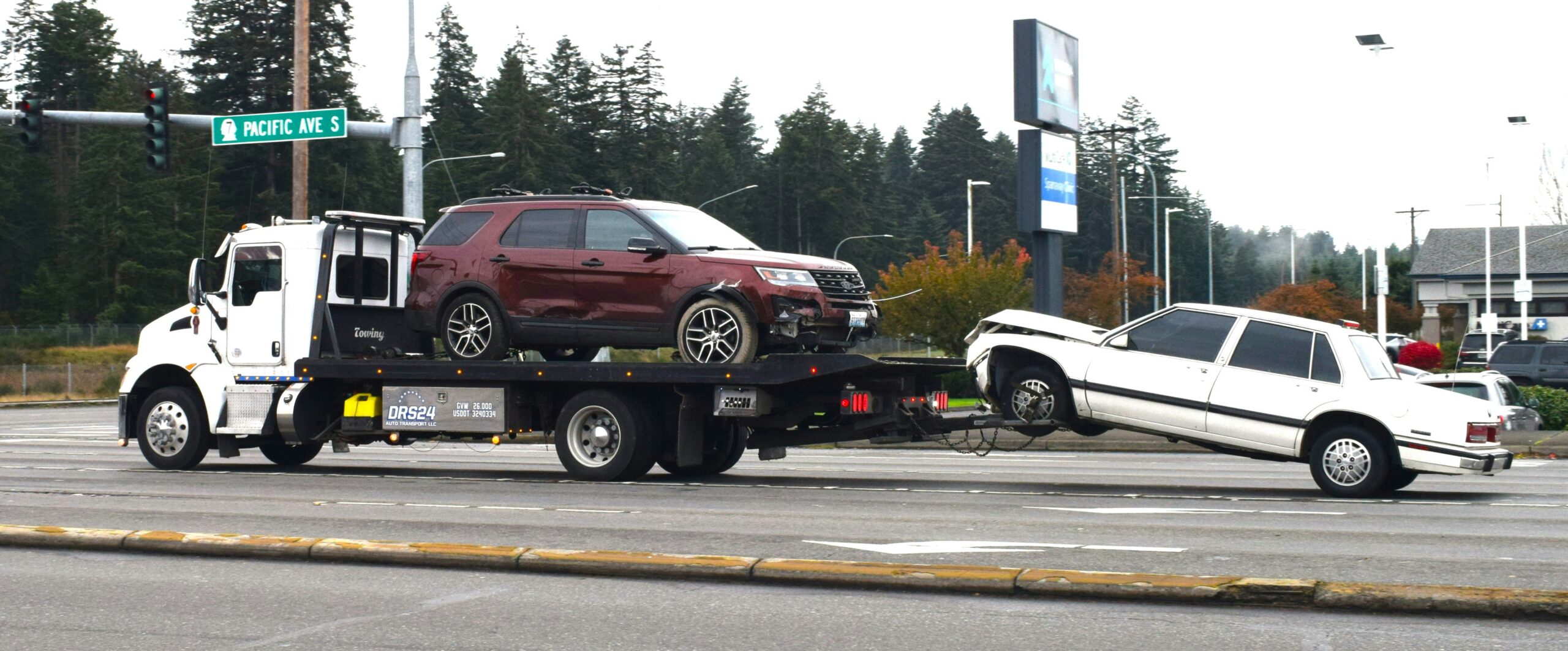 Cars being towed as a part of road service in Japan